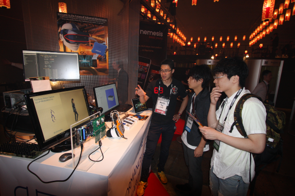 Our booth at Slush Asia was pretty popular. CTO Yap is explaining to visitors.